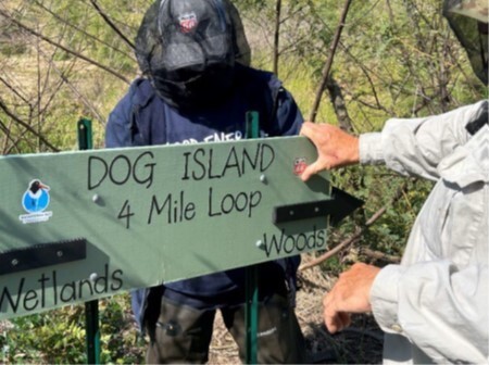 Phillips 66 volunteers installing signage on Dog Island