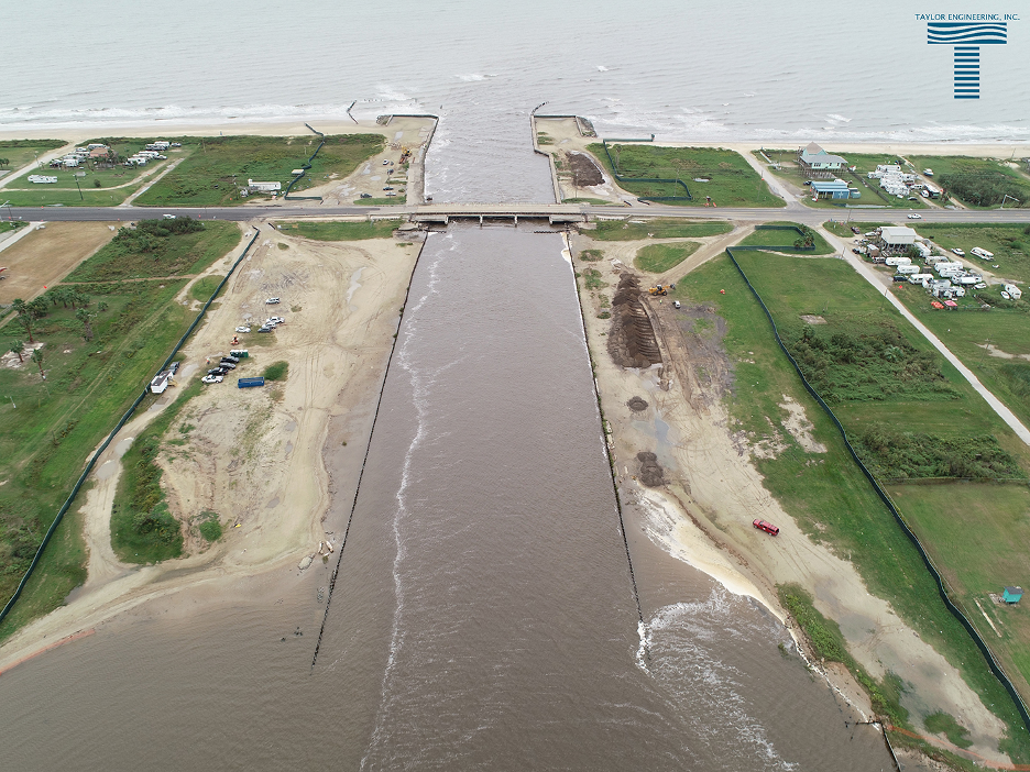 A bridge over a strait connecting two large bodies of water