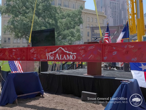 A signed beam from various community leaders, students and elected officials is prepared to be raised as the final construction beam at the Texas Cavaliers Alamo Education Center on Wednesday, May 14, 2025