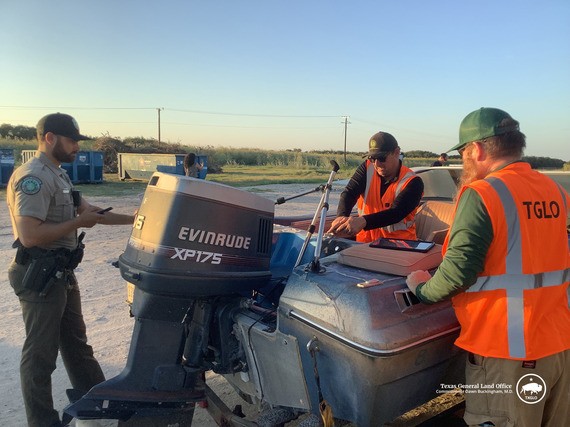 Texas General Land Office (GLO) employees survey a vessel turned in during the Ingleside VTIP event in 2024