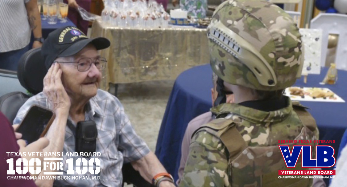 Mr. Wiley Tow speaks to a young gentleman at his 100th Birthday Celebration