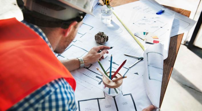 Image of an architect drawing plans
